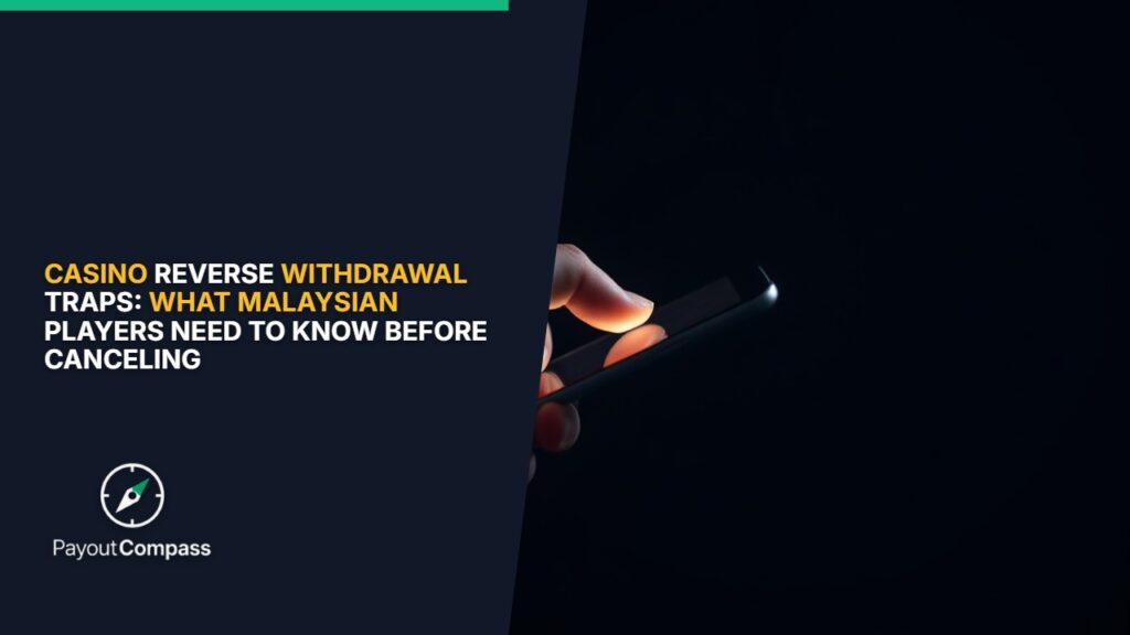 Hand holding smartphone showing reverse withdrawal traps in online casino interface Malaysia
